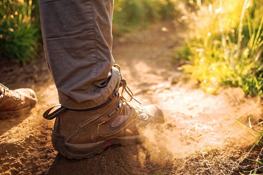Boots in a healthy crop field